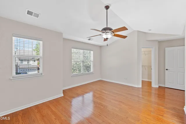 a view of a room with wooden floor