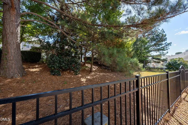 a swimming pool with wooden fence