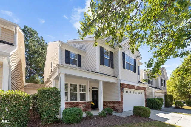 a front view of a house with yard