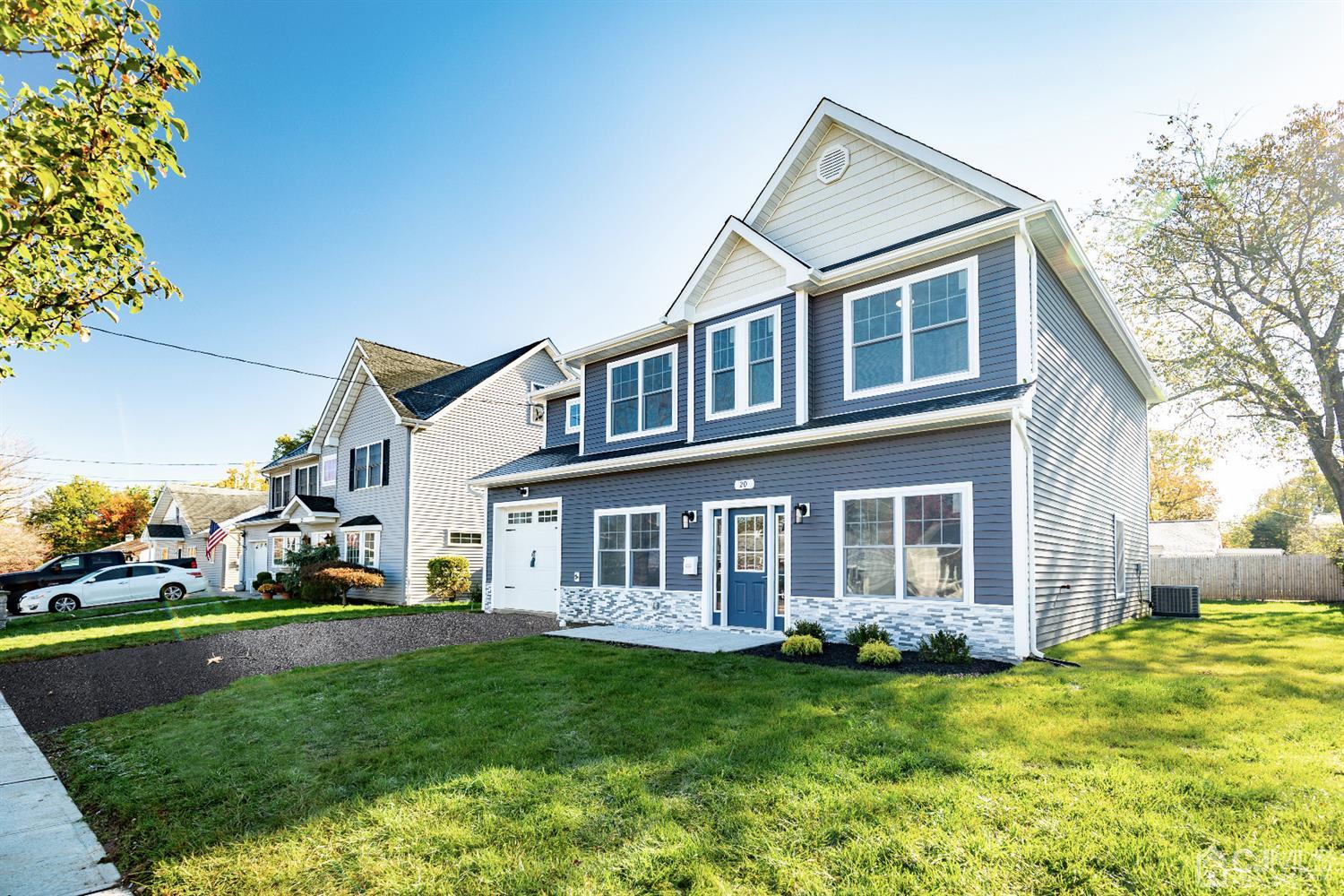 20 Winthrop Road Edison, NJ 08817 - Photo 2 of 55 a front view of a house with a garden