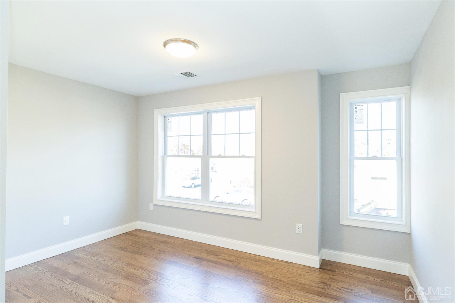 20 Winthrop Road Edison, NJ 08817 - Photo 23 of 55 an empty room with wooden floor and windows
