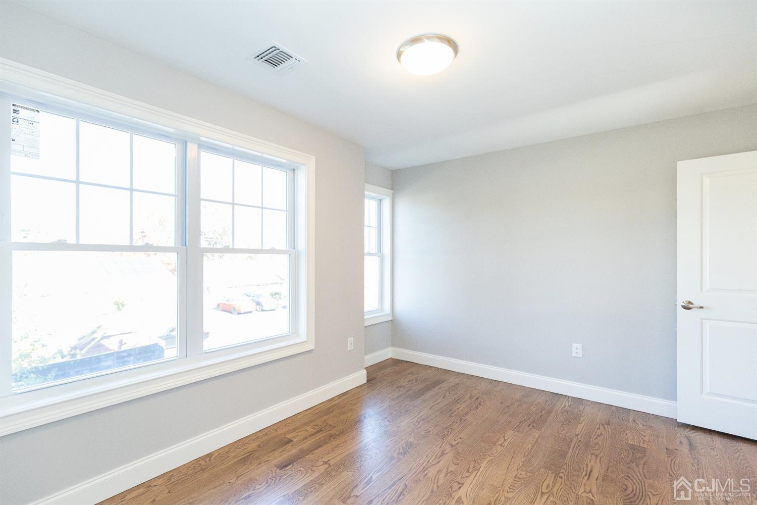 20 Winthrop Road Edison, NJ 08817 - Photo 26 of 55 an empty room with wooden floor and windows