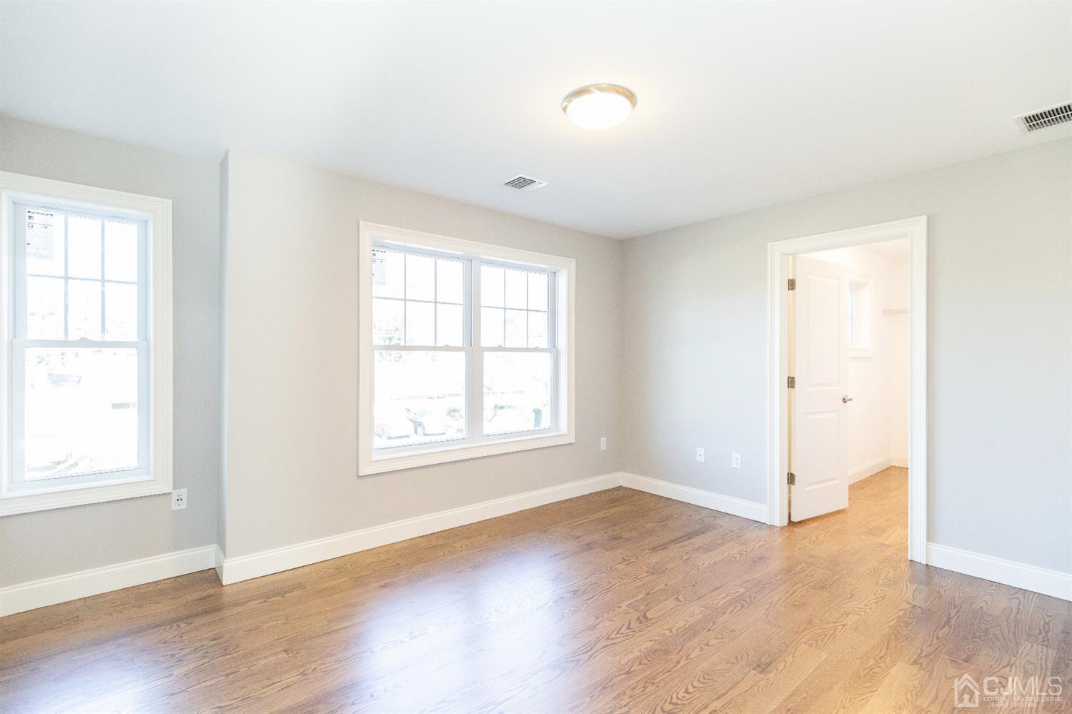20 Winthrop Road Edison, NJ 08817 - Photo 27 of 55 an empty room with wooden floor and windows