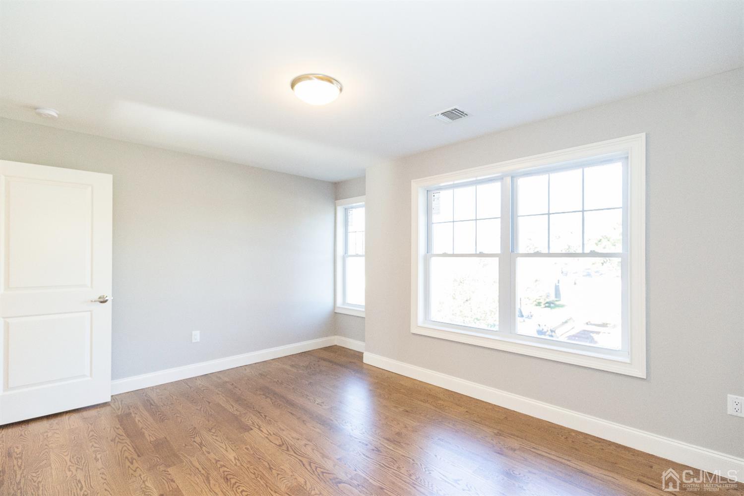 20 Winthrop Road Edison, NJ 08817 - Photo 30 of 55 an empty room with wooden floor and windows