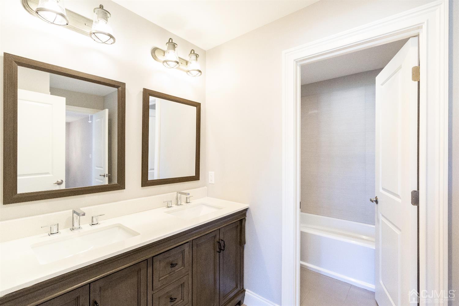 20 Winthrop Road Edison, NJ 08817 - Photo 32 of 55 a bathroom with a double vanity sink mirror and a