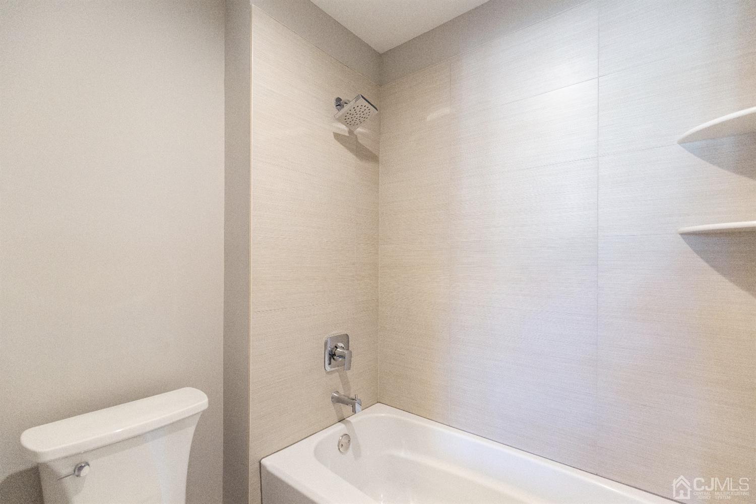 20 Winthrop Road Edison, NJ 08817 - Photo 33 of 55 a bath room with a toilet a sink and a shower