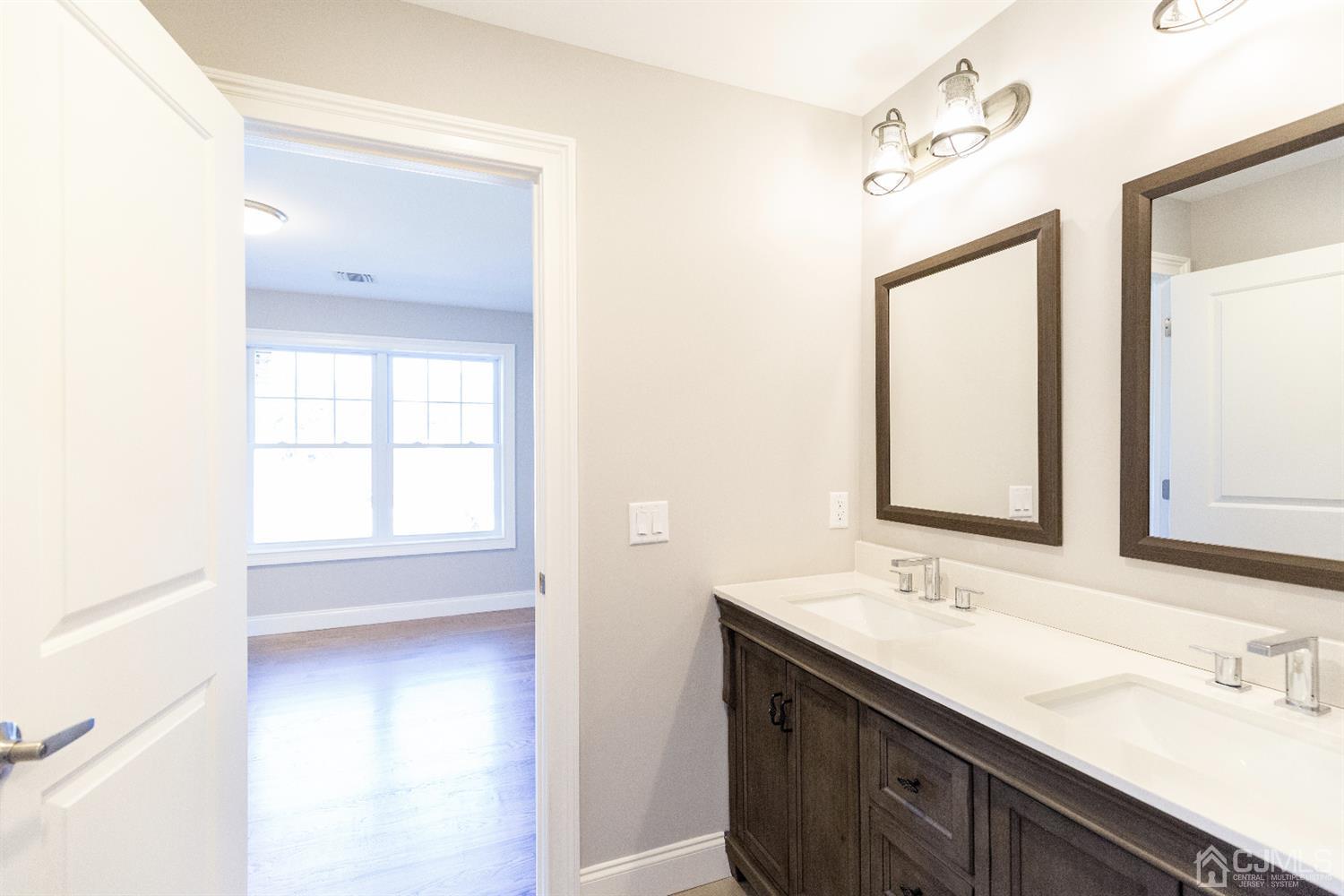 20 Winthrop Road Edison, NJ 08817 - Photo 34 of 55 a bathroom with a sink a vanity and a mirror
