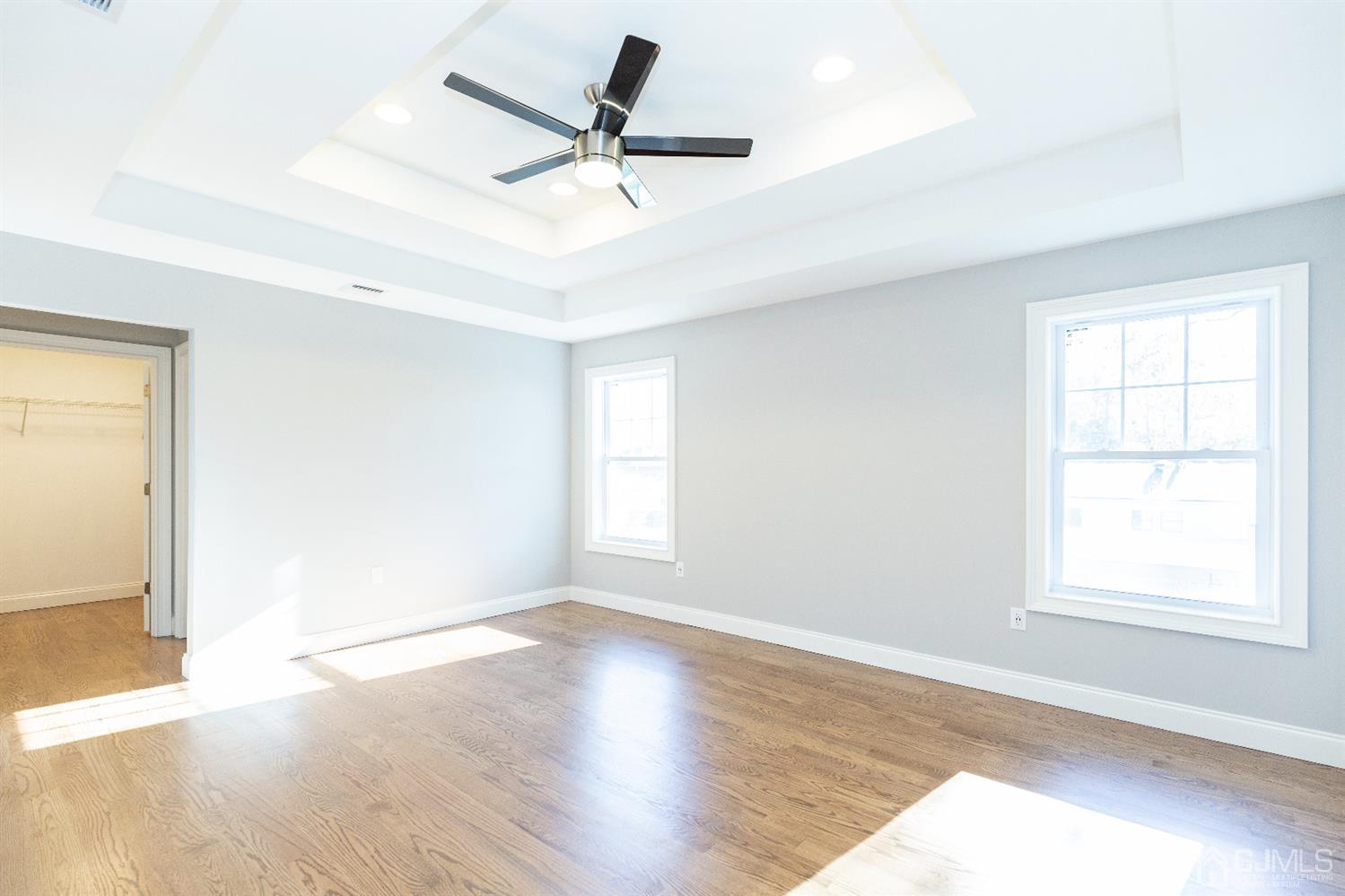 20 Winthrop Road Edison, NJ 08817 - Photo 37 of 55 an empty room with wooden floor fan and windows