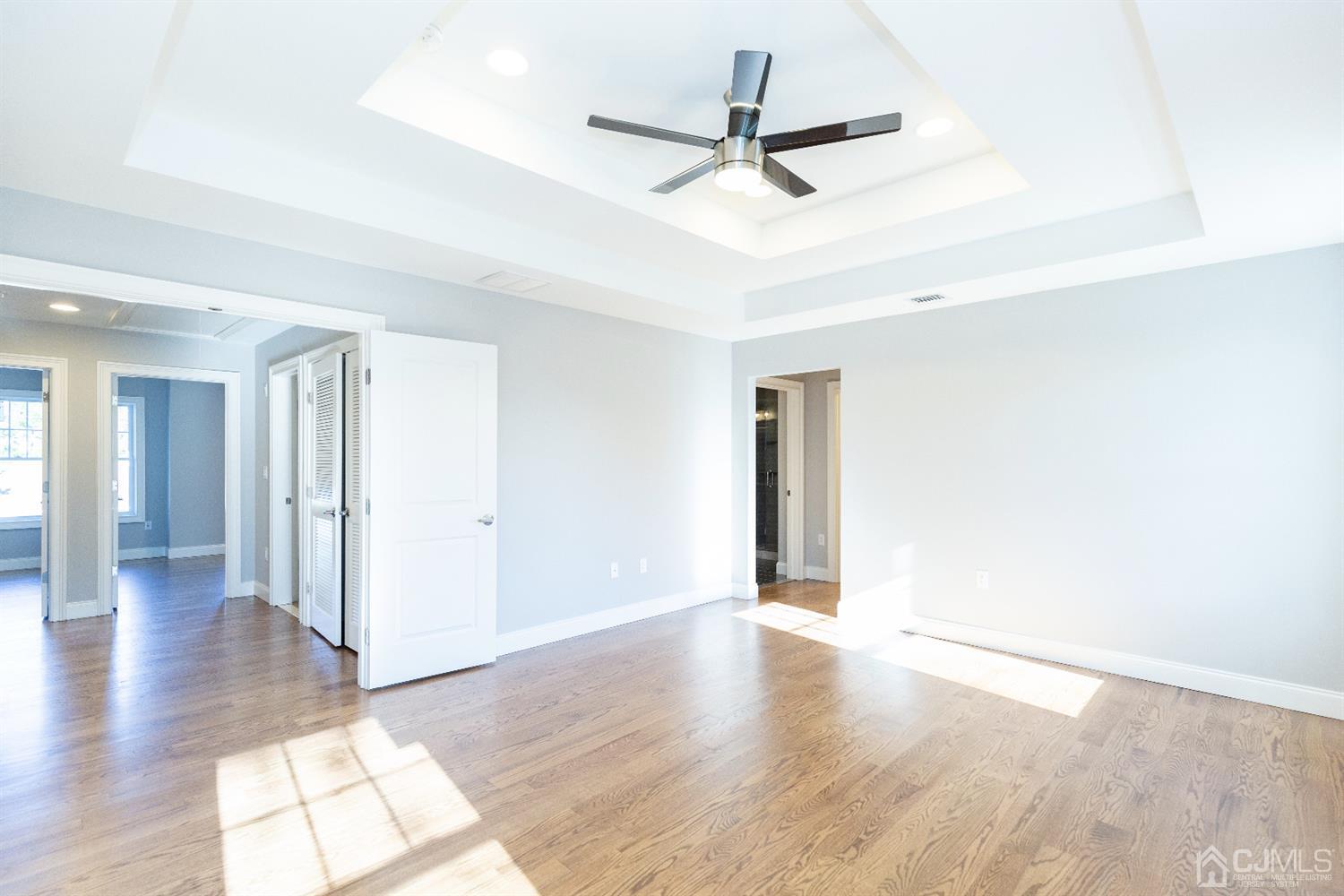 20 Winthrop Road Edison, NJ 08817 - Photo 38 of 55 a view of a livingroom with wooden floor and a ceiling fan