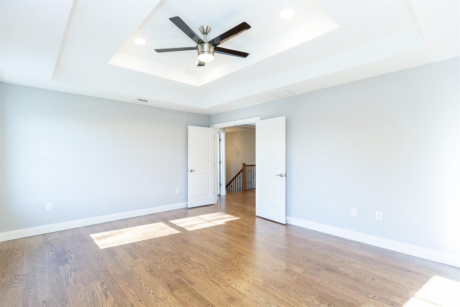 20 Winthrop Road Edison, NJ 08817 - Photo 39 of 55 an empty room with wooden floor and a ceiling fan