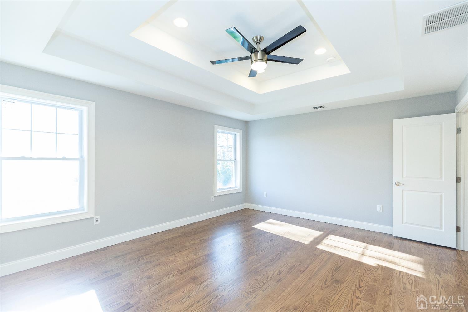 20 Winthrop Road Edison, NJ 08817 - Photo 40 of 55 an empty room with wooden floor and windows