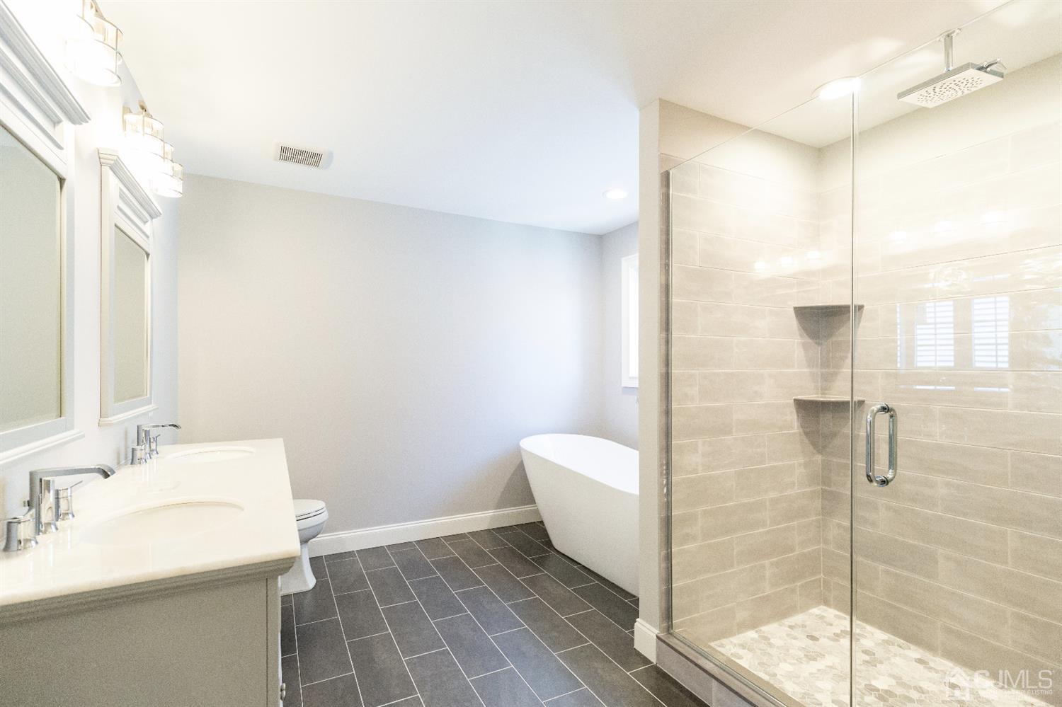 20 Winthrop Road Edison, NJ 08817 - Photo 43 of 55 a bathroom with a sink and mirror