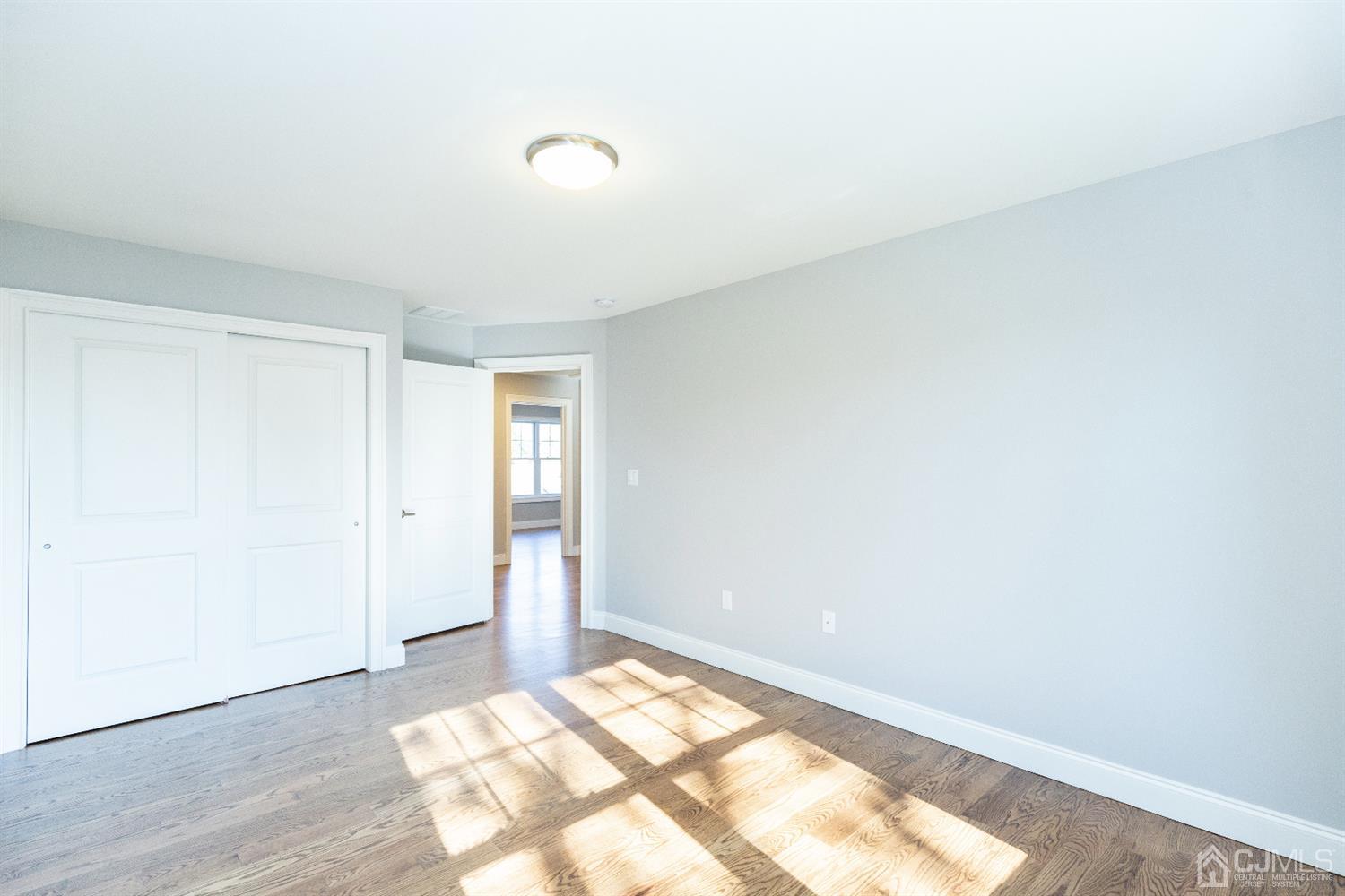 20 Winthrop Road Edison, NJ 08817 - Photo 49 of 55 an empty room with wooden floor and windows