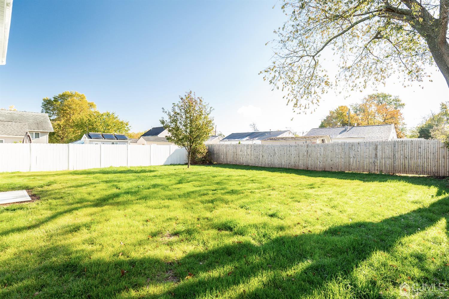 20 Winthrop Road Edison, NJ 08817 - Photo 55 of 55 a view of yard with swimming pool and wooden fence