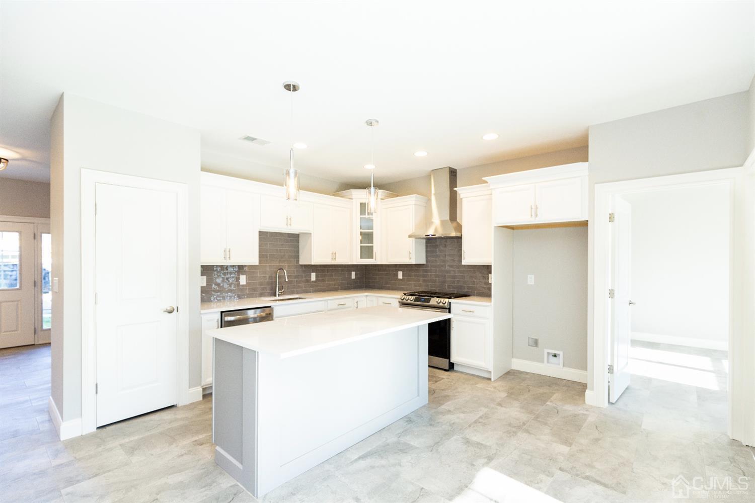 20 Winthrop Road Edison, NJ 08817 - Photo 10 of 55 a kitchen with a stove a refrigerator and a sink