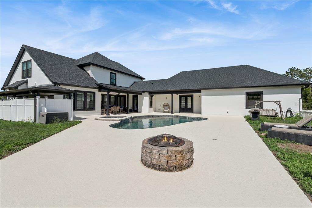 345 Cypress Isles Road Osteen, FL 32764 - Photo 27 of 41 a front view of a house with a garden