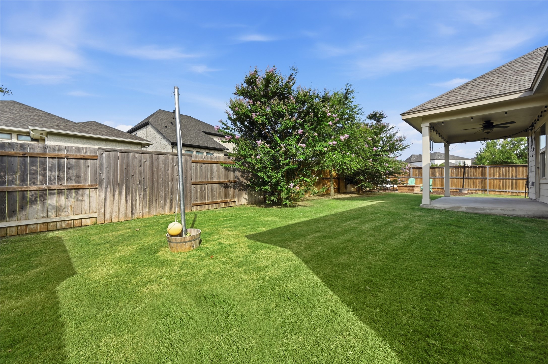426 Cold Riv Run Kyle, TX 78640 - Photo 33 of 34 A spacious, manicured lawn with a covered patio offers ample outdoor living potential.