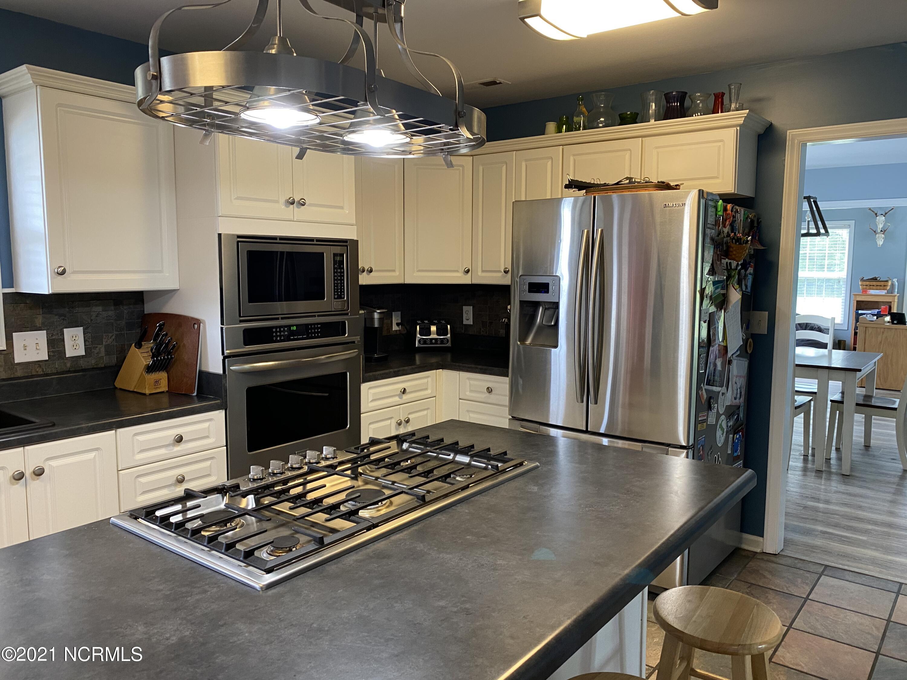 4218 Old Cherry Point Road New Bern, NC 28560 - Photo 19 of 76 kitchen to dining room