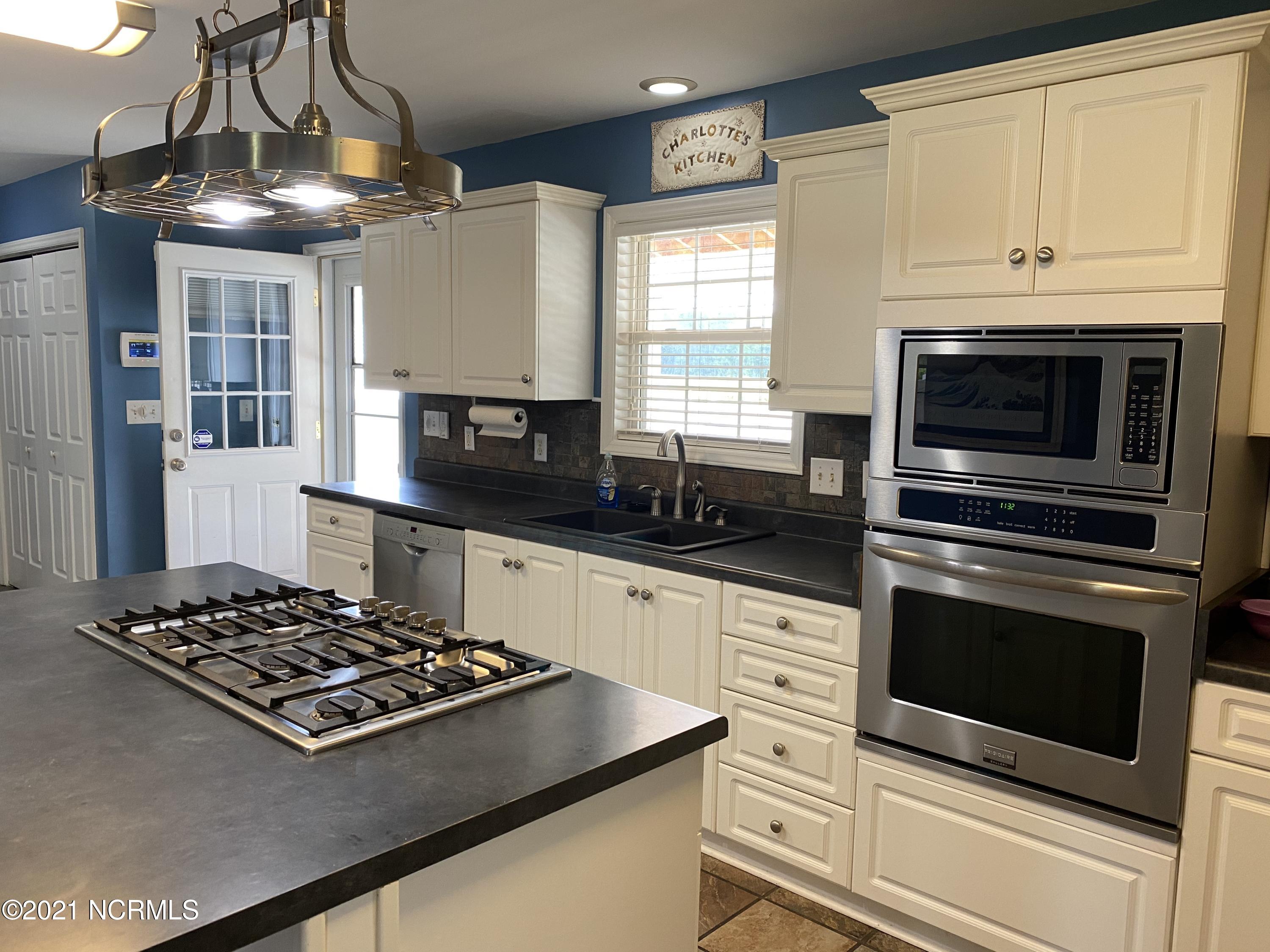 4218 Old Cherry Point Road New Bern, NC 28560 - Photo 24 of 76 kitchen to back deck