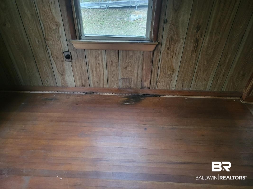 2059 Magnolia Lane Mobile, AL 36605 - Photo 7 of 17 Room details with wooden walls