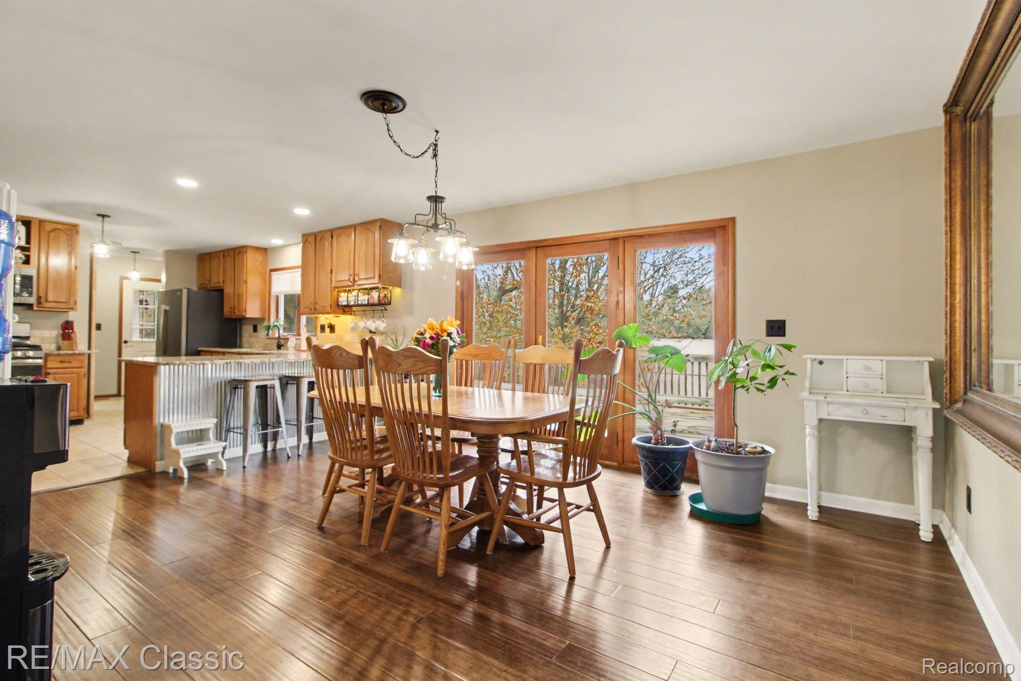 9800 Moon Road Saline, MI 48176 - Photo 11 of 38 Dining area featuring hanging lights and bamboo flooring