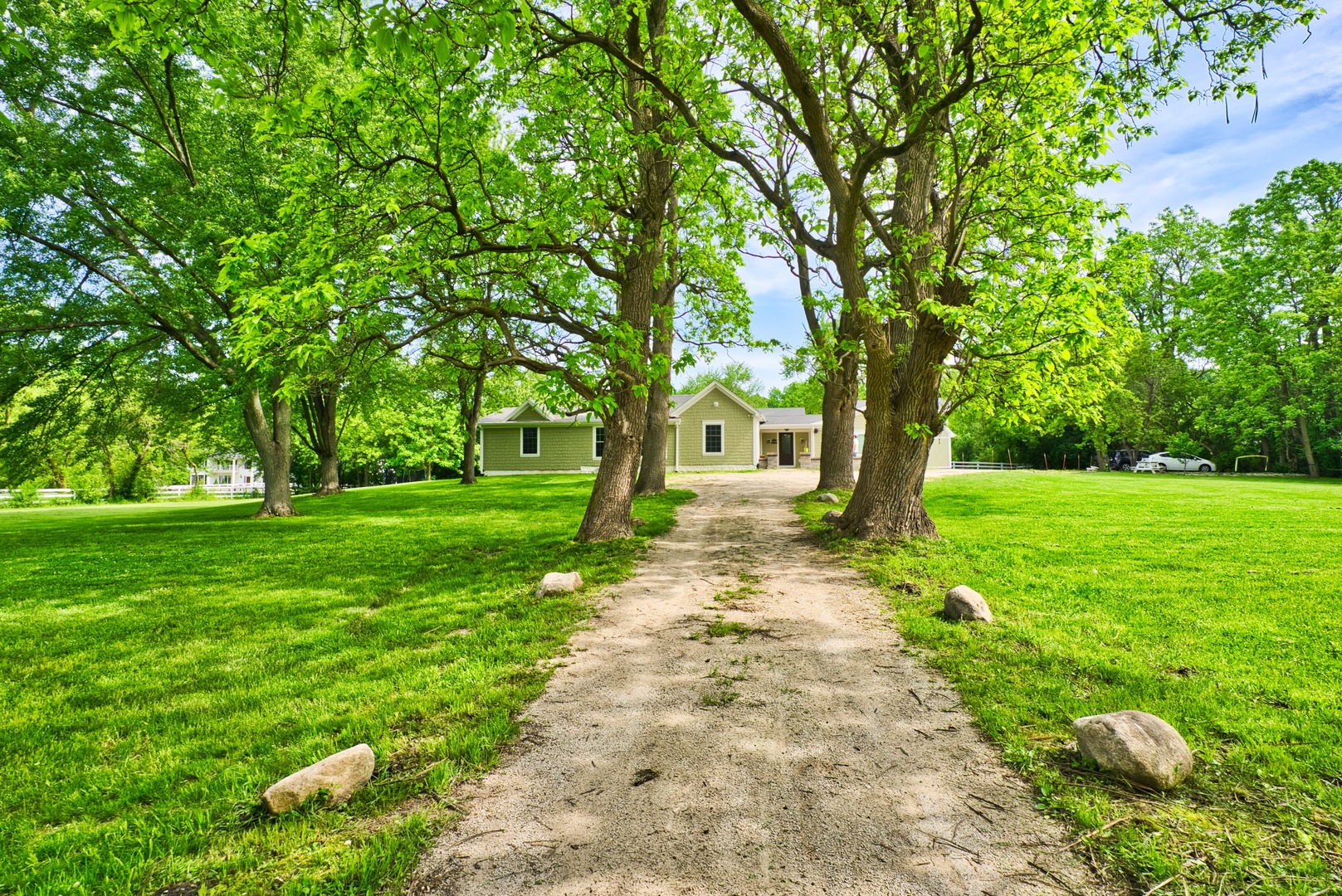 33W878 Army Trail Road Wayne, IL 60184 - Photo 2 of 36 a front view of a house with garden