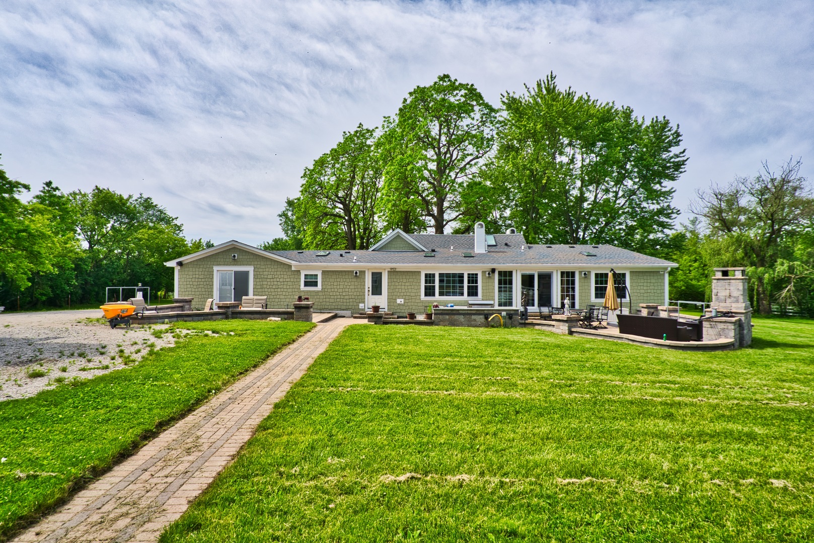 33W878 Army Trail Road Wayne, IL 60184 - Photo 11 of 36 a front view of a house with garden