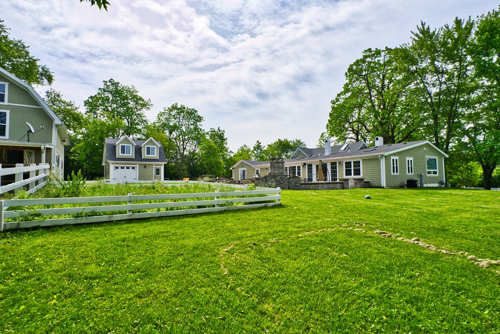 33W878 Army Trail Road Wayne, IL 60184 - Photo 15 of 36 a front view of a house with a garden