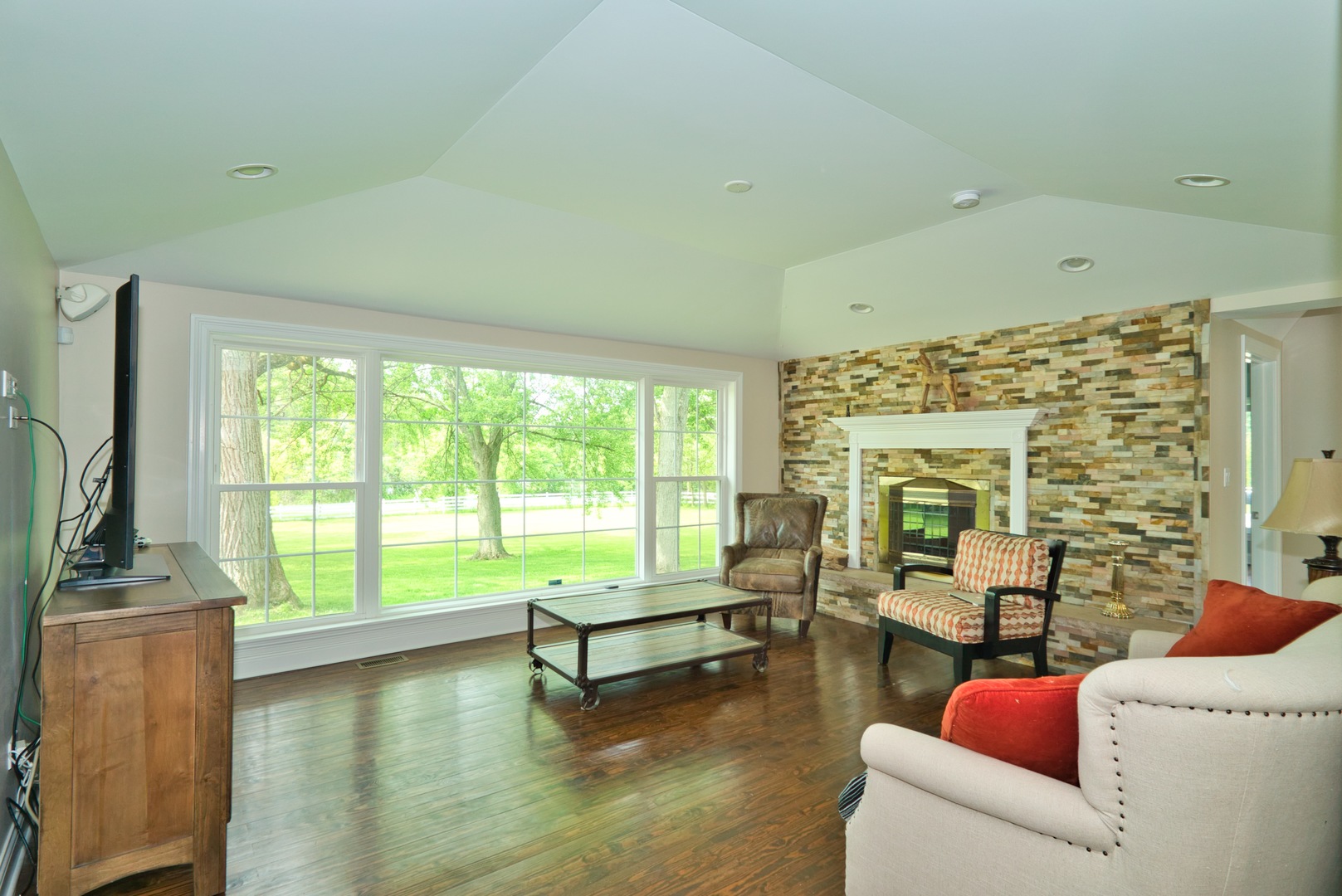 33W878 Army Trail Road Wayne, IL 60184 - Photo 27 of 36 a living room with furniture and a large window