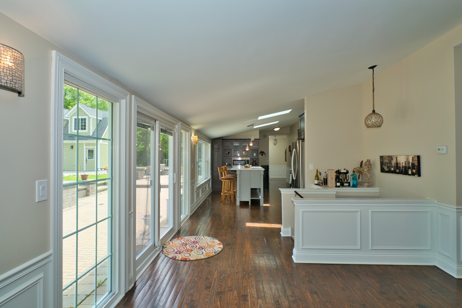 33W878 Army Trail Road Wayne, IL 60184 - Photo 29 of 36 a living room with furniture and a floor to ceiling window