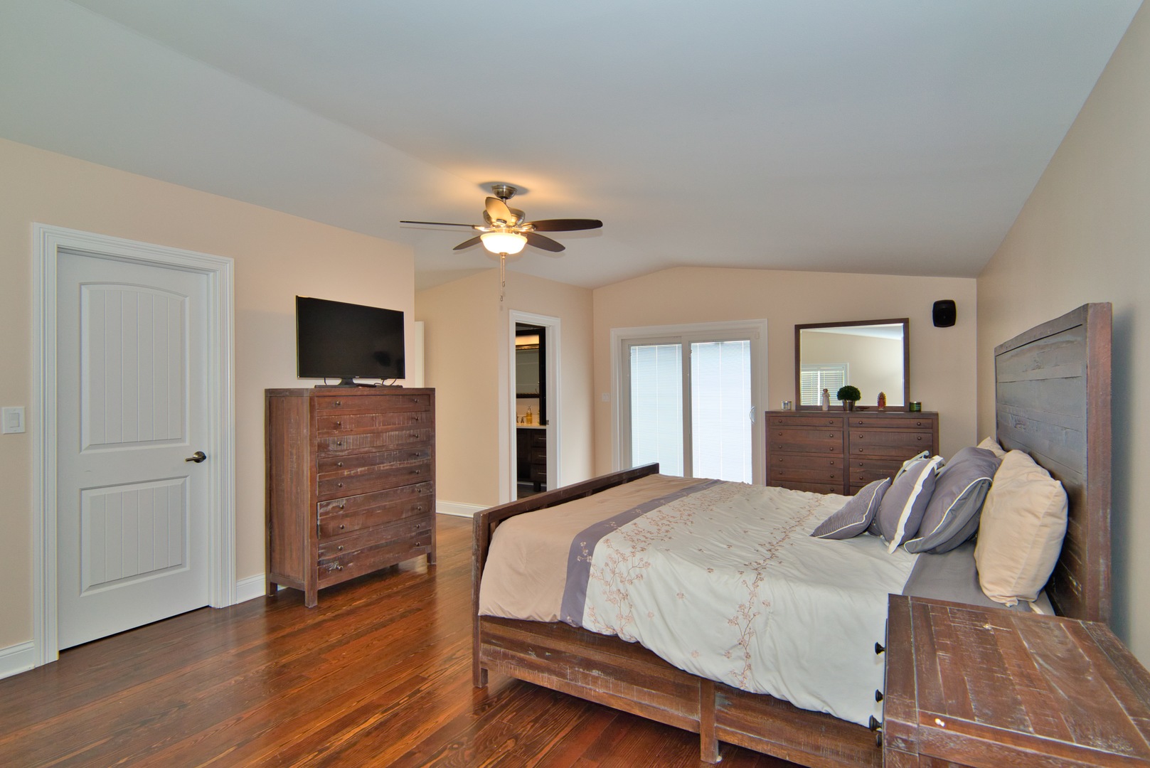 33W878 Army Trail Road Wayne, IL 60184 - Photo 30 of 36 a bedroom with a bed and a flat screen tv