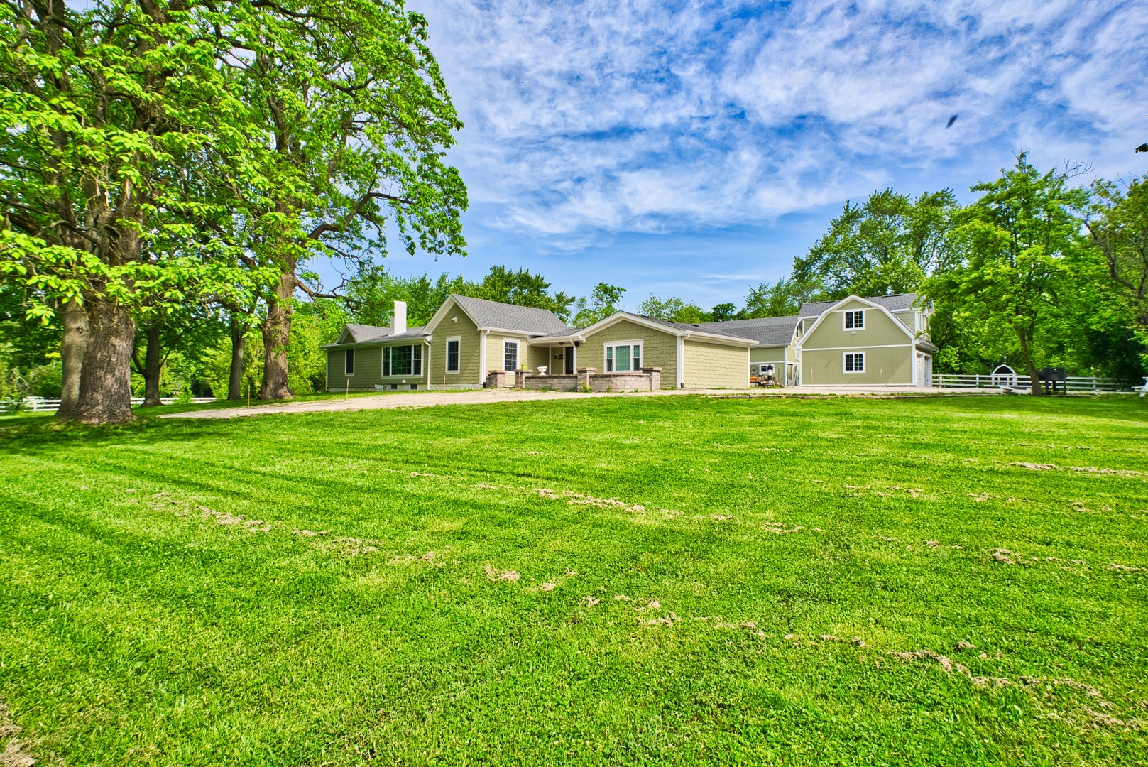 33W878 Army Trail Road Wayne, IL 60184 - Photo 4 of 36 a white house with a big yard and large trees