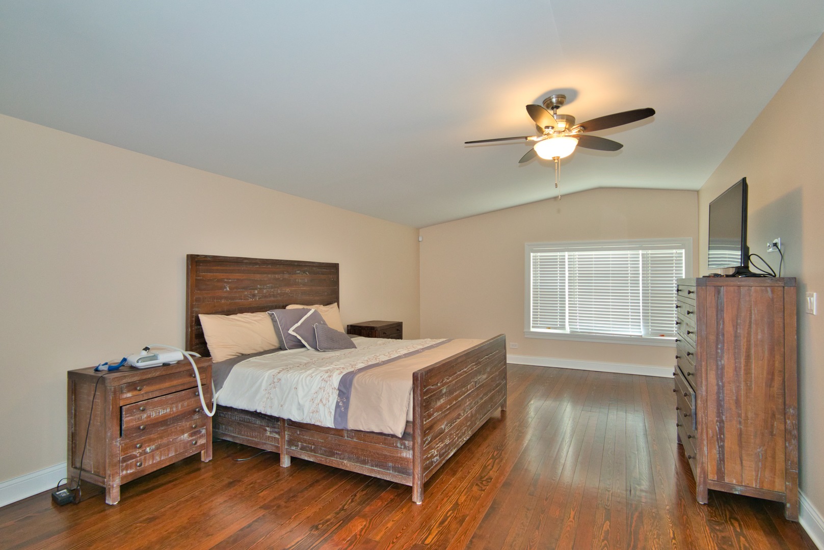 33W878 Army Trail Road Wayne, IL 60184 - Photo 31 of 36 a bedroom with a bed chandelier and a window
