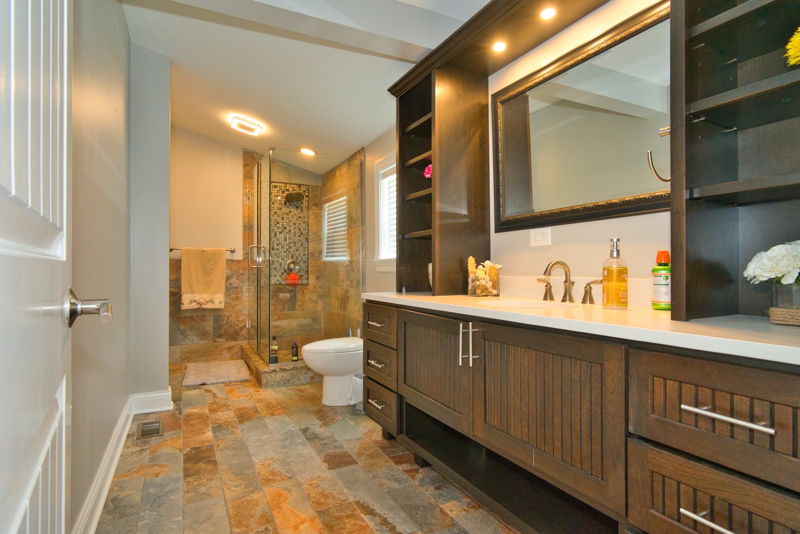 33W878 Army Trail Road Wayne, IL 60184 - Photo 32 of 36 a spacious bathroom with a double vanity sink a mirror and a shower