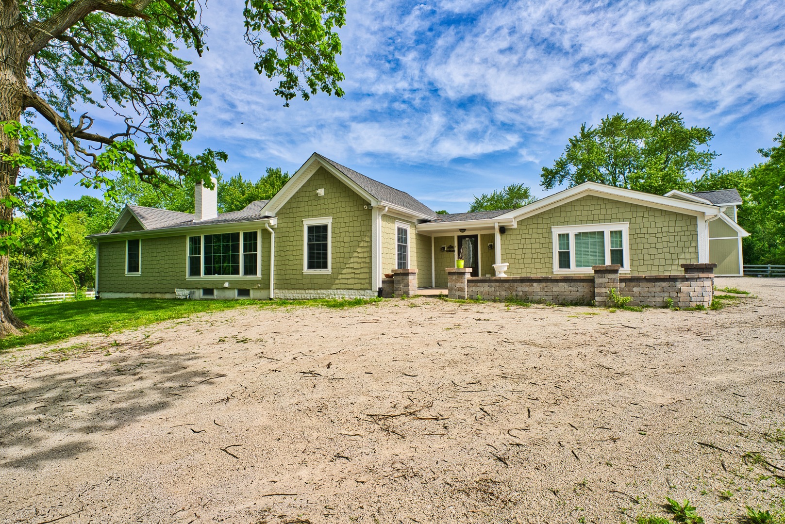 33W878 Army Trail Road Wayne, IL 60184 - Photo 6 of 36 a front view of a house with a garden