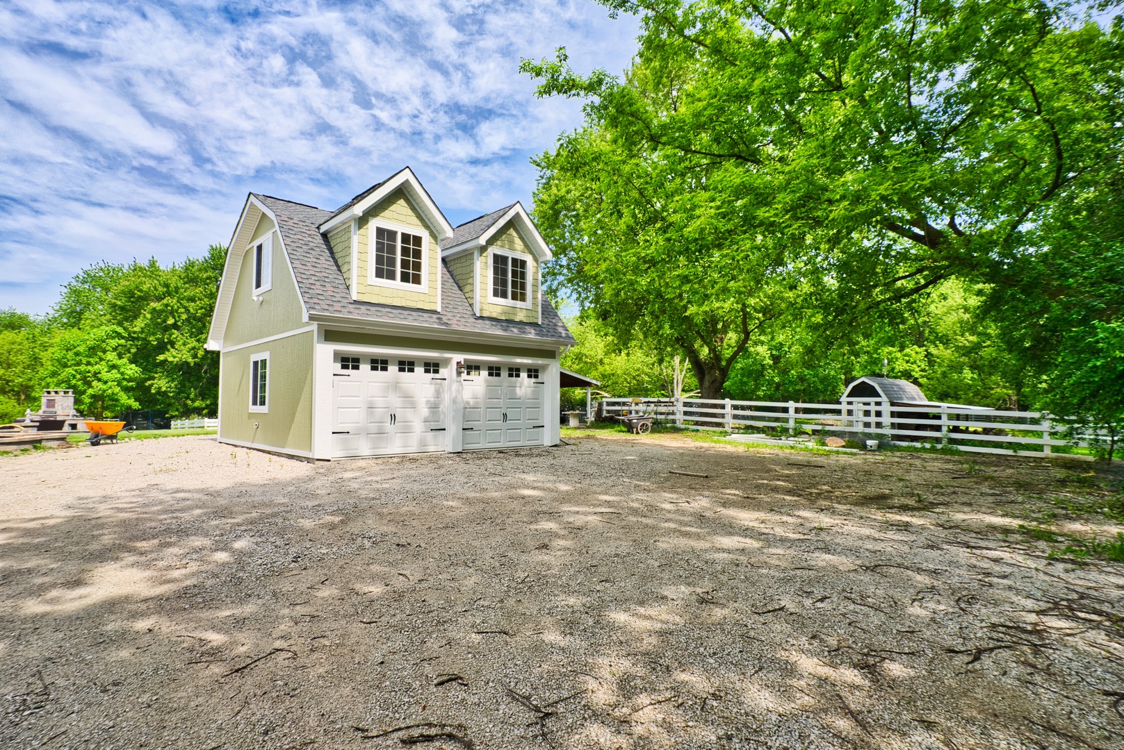 33W878 Army Trail Road Wayne, IL 60184 - Photo 8 of 36 a view of a small house with a yard and large trees