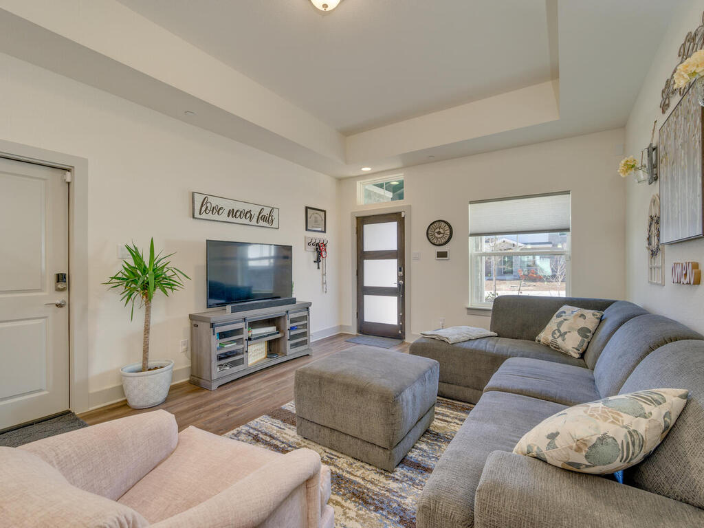 2257 Local Rebel Loop Leander, TX 78641 - Photo 6 of 26 a living room with furniture and a flat screen tv