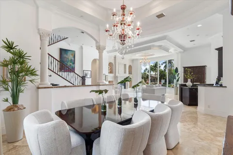 a kitchen with stainless steel appliances granite countertop a sink and a refrigerator