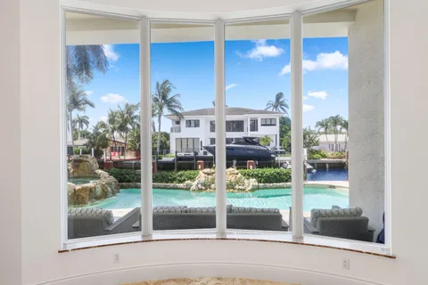 a view of kitchen with sink and microwave