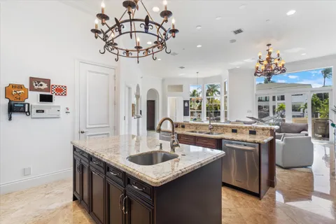a living room with furniture a flat screen tv and a large window