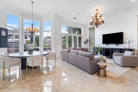 a view of a building with potted plants and a patio