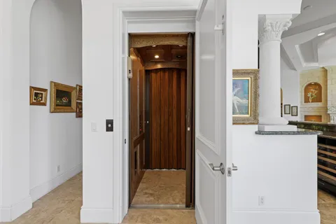 a view of a balcony with furniture