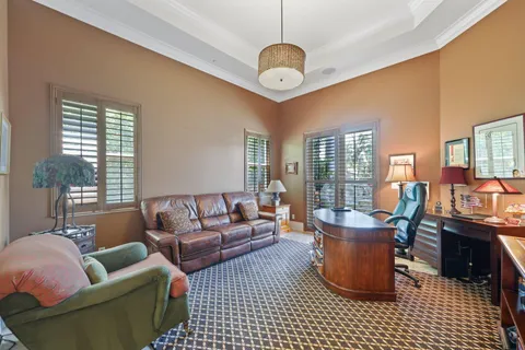 a bathroom with a granite countertop sink toilet a large mirror a bathtub and shower