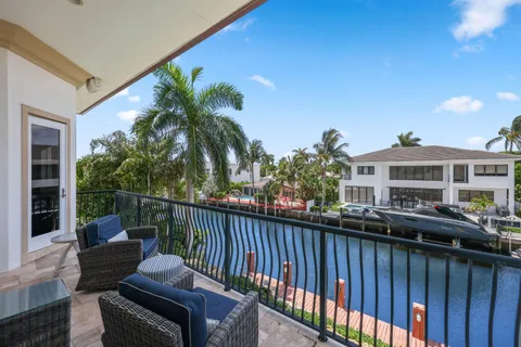 a bedroom with furniture and a large window