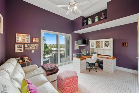 a bathroom with a granite countertop sink a toilet and a shower