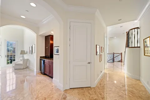 a view of a house with swimming pool and sitting area