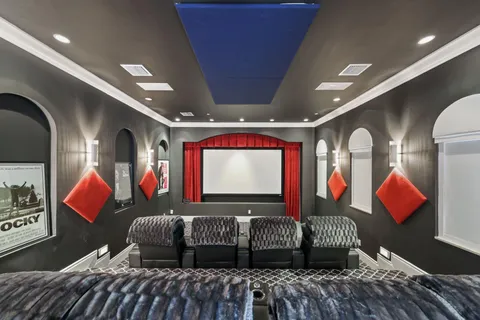 a view of a house with swimming pool and sitting area