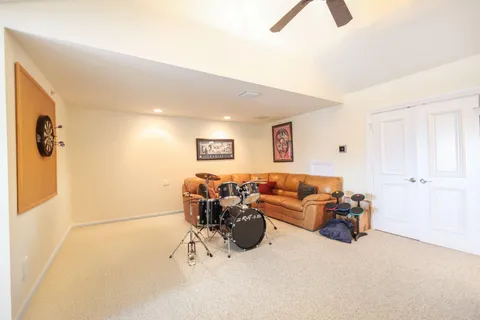 a view of a lake with a bench and trees around