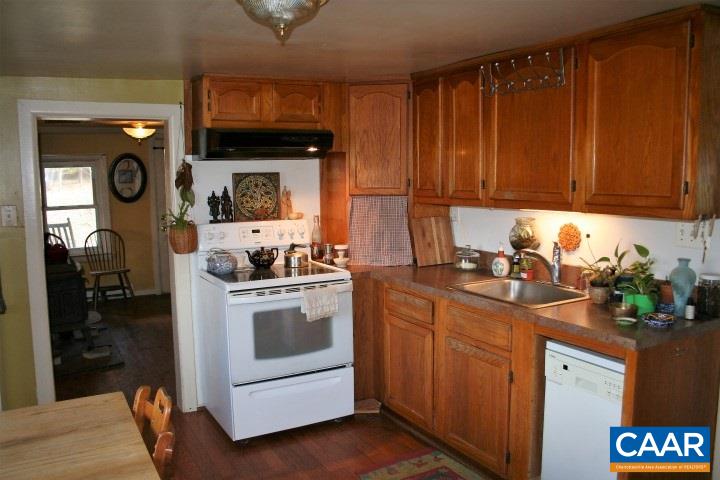 11582 Obannons Mill Road Boston, VA 22713 - Photo 16 of 36 a kitchen with a sink cabinets and appliances