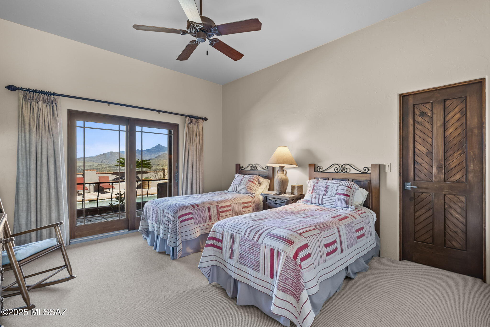 1265 Morning Star Drive Rio Rico, AZ 85648 - Photo 17 of 50 a bedroom with two beds and large window